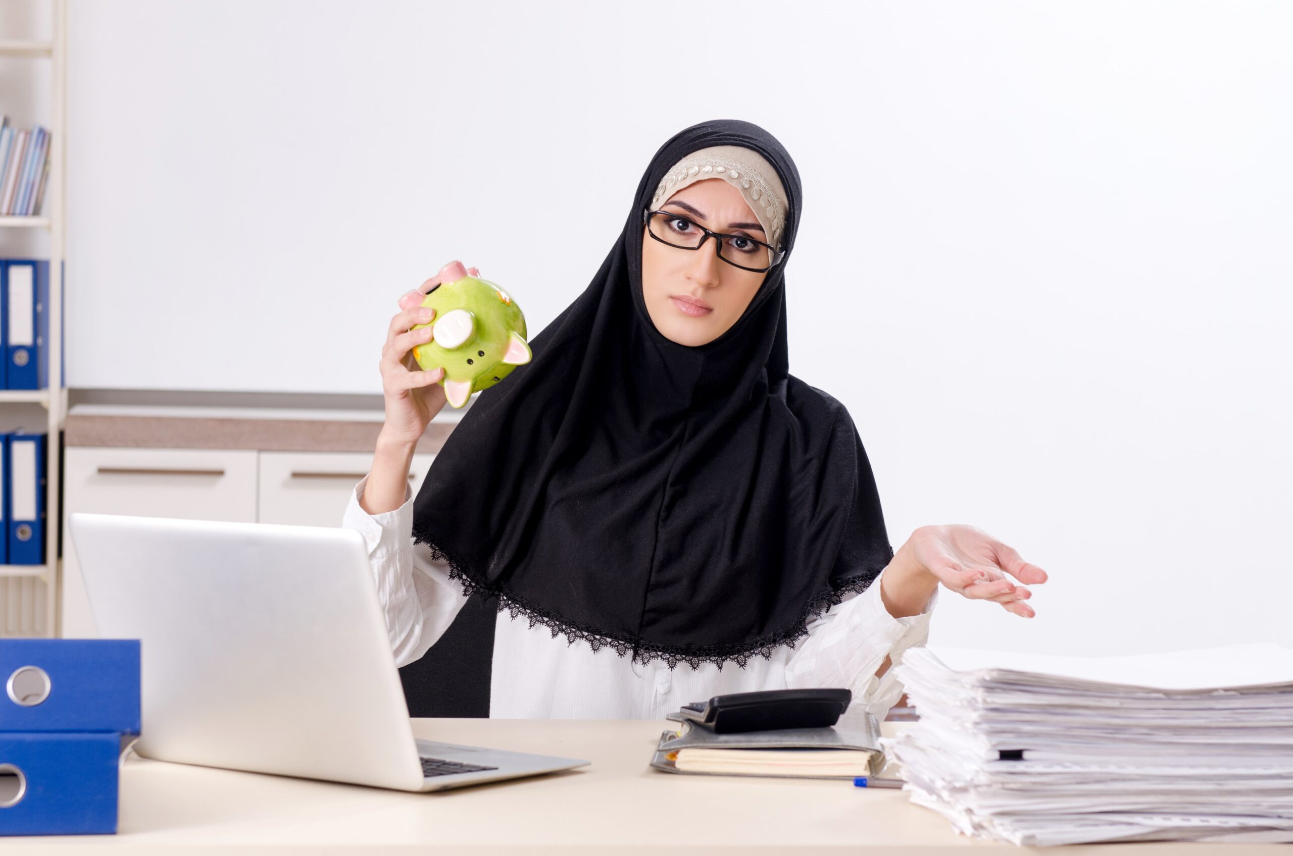 Frustrated person sitting at desk surrounded by scattered immigration documents and forms with confused expression indicating visa application difficulties
